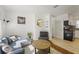 Cozy living room with modern furnishings and an open layout flowing into the kitchen at 3600 46Th N St, St Petersburg, FL 33713