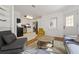 Stylish living room with modern furniture, an open layout, and kitchen access at 3600 46Th N St, St Petersburg, FL 33713
