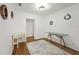 Office featuring wood floors, glass desk, and decorative wall art at 3600 46Th N St, St Petersburg, FL 33713