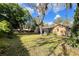 Expansive backyard with a covered patio, perfect for enjoying the serene and peaceful outdoor environment at 3907 Applegate Cir, Brandon, FL 33511