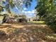 Large, private backyard with mature trees, providing plenty of room for outdoor activities and entertaining at 3907 Applegate Cir, Brandon, FL 33511