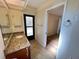 Well-lit bathroom with granite countertops, and tile flooring at 3907 Applegate Cir, Brandon, FL 33511