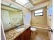 Bathroom showcasing granite countertops and a shower-tub combo at 3907 Applegate Cir, Brandon, FL 33511