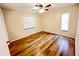 Bedroom featuring hardwood floors, a ceiling fan, and window at 3907 Applegate Cir, Brandon, FL 33511