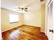 Bedroom with wood floors, and a large window offering natural light at 3907 Applegate Cir, Brandon, FL 33511