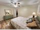 Bedroom view with wood flooring, ceiling fan, and bureau at 3907 Applegate Cir, Brandon, FL 33511