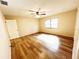 This bright and airy bedroom features sleek wood floors and a ceiling fan at 3907 Applegate Cir, Brandon, FL 33511