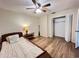 Neutral bedroom featuring wood floors, a ceiling fan, and closet at 3907 Applegate Cir, Brandon, FL 33511
