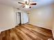 Spacious bedroom with wood floors, ceiling fan, and closet at 3907 Applegate Cir, Brandon, FL 33511