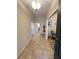 Inviting entryway with neutral tile flooring and a view of a dining area featuring hardwood floors at 3907 Applegate Cir, Brandon, FL 33511