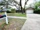 Home boasts a well-maintained lawn and mature trees at 3907 Applegate Cir, Brandon, FL 33511