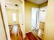 Bright hallway with hardwood floors connecting to bedroom and bathroom at 3907 Applegate Cir, Brandon, FL 33511