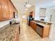 Spacious kitchen with granite countertops and stainless steel appliances, ideal for cooking at 3907 Applegate Cir, Brandon, FL 33511