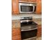 Close up of stainless steel oven and microwave in kitchen at 3907 Applegate Cir, Brandon, FL 33511
