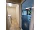 Laundry room leading to a spacious garage with epoxy floors at 3907 Applegate Cir, Brandon, FL 33511