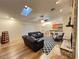 Bright open-concept living area with fireplace, skylights, hardwood floors, and eat-in kitchen at 3907 Applegate Cir, Brandon, FL 33511