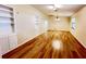 Bright living room features hardwood floors and built-in shelving at 3907 Applegate Cir, Brandon, FL 33511
