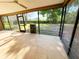 The screened patio features views of the backyard and a grill for outdoor cooking at 3907 Applegate Cir, Brandon, FL 33511