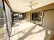 A screened-in porch featuring ceiling fans and glass sliding doors leading into the home at 3907 Applegate Cir, Brandon, FL 33511