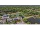Beautiful aerial view of home with lush landscaping and tranquil pond views at 417 Ventura Dr, Oldsmar, FL 34677