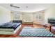 Bright, spacious bedroom with hardwood floors, plantation shutters, and a ceiling fan at 417 Ventura Dr, Oldsmar, FL 34677