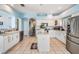 Spacious kitchen features a center island, stainless steel appliances, and ample counter space at 417 Ventura Dr, Oldsmar, FL 34677