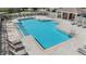 A pristine swimming pool with ample lounge seating and a bathhouse, offering a resort-like experience for residents at 417 Ventura Dr, Oldsmar, FL 34677