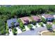 Aerial view of neighborhood showcasing well-maintained homes with lush landscaping along a quiet street at 4289 Ortona Ln, Wesley Chapel, FL 33543