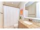 Bathroom with a shower/tub combo, a granite vanity, and neutral paint at 4289 Ortona Ln, Wesley Chapel, FL 33543