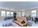 Large game room with a pool table, foosball table, and a leather couch at 4289 Ortona Ln, Wesley Chapel, FL 33543