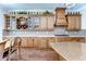 Well-designed kitchen with extensive cabinetry, wine rack, and granite countertops, ideal for gourmet cooking and hosting at 4289 Ortona Ln, Wesley Chapel, FL 33543