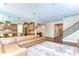 Living room featuring hardwood floors, an open floor plan, and a staircase at 4289 Ortona Ln, Wesley Chapel, FL 33543