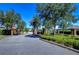 Elegant entrance showcasing brick columns and wrought iron gates, creating an inviting arrival at 4289 Ortona Ln, Wesley Chapel, FL 33543