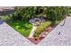 A charming backyard featuring a brick-paved firepit area with comfortable seating and lush landscaping at 4340 Narvarez S Way, St Petersburg, FL 33712