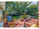 Inviting backyard deck features cozy seating and lush landscaping, creating a serene outdoor living space at 4340 Narvarez S Way, St Petersburg, FL 33712