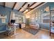 Inviting bedroom with vaulted ceilings, exposed beams, and a cozy sitting area for relaxation at 4340 Narvarez S Way, St Petersburg, FL 33712