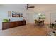 Bright dining room with terra cotta tile flooring, ceiling fan, modern lighting, and casual seating for four at 4340 Narvarez S Way, St Petersburg, FL 33712
