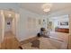 Hallway with hardwood flooring, coat closet, and view to the dining room and living room at 4340 Narvarez S Way, St Petersburg, FL 33712