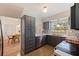 Updated kitchen with gray cabinetry and view to the dining room at 4340 Narvarez S Way, St Petersburg, FL 33712