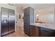 Modern kitchen with stainless steel refrigerator and view to the dining room at 4340 Narvarez S Way, St Petersburg, FL 33712