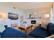 Inviting living room with vaulted ceiling, ample seating, and a large television for entertaining at 4340 Narvarez S Way, St Petersburg, FL 33712