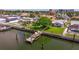 Aerial view of waterfront property with a private dock, pool and lush greenery at 4433 38Th S Way, St Petersburg, FL 33711