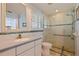 Updated bathroom featuring a glass shower with a rain shower head and a single sink vanity at 4433 38Th S Way, St Petersburg, FL 33711