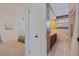 Bathroom with a step-in shower and dark wood vanity with access to a bedroom at 4433 38Th S Way, St Petersburg, FL 33711