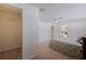 Spacious bedroom with a ceiling fan, walk-in closet, and backyard views at 4433 38Th S Way, St Petersburg, FL 33711