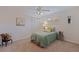 Comfortable bedroom with a ceiling fan, shuttered windows, and a large closet at 4433 38Th S Way, St Petersburg, FL 33711