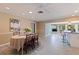 Open dining area features a round table, tile flooring, and natural light from a large window at 4433 38Th S Way, St Petersburg, FL 33711