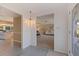 Open foyer featuring tile flooring, a view into the living room, and an elegant pendant light at 4433 38Th S Way, St Petersburg, FL 33711