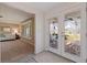 Inviting foyer with decorative glass doors, tile flooring, and a glimpse into the living room at 4433 38Th S Way, St Petersburg, FL 33711
