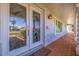 Elegant front door with decorative glass panels, textured stone accents, and a brick walkway at 4433 38Th S Way, St Petersburg, FL 33711